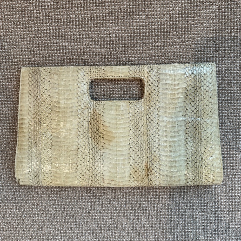 Beirn snakeskin clutch with cut out handle